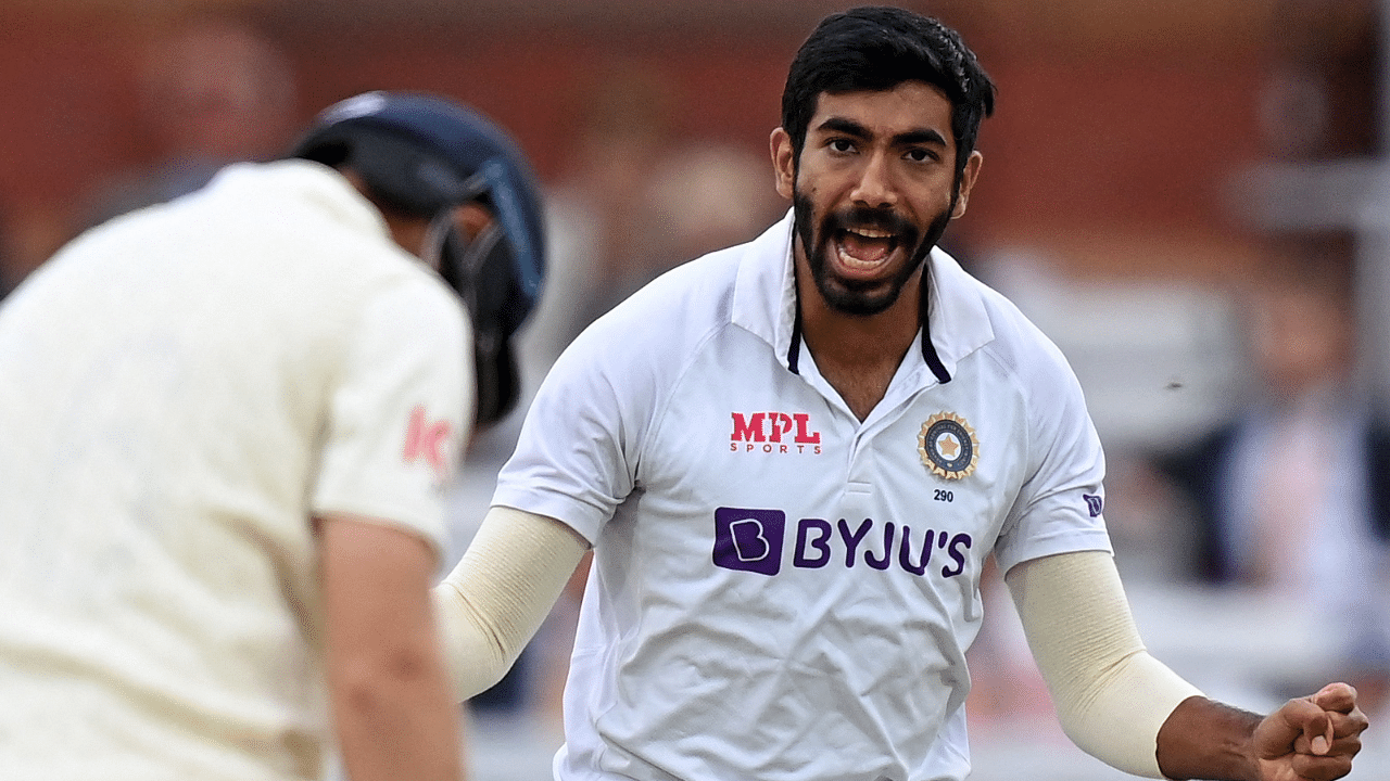 India's Jasprit Bumrah (R) celebrates dismissing England's captain Joe Root for 33 runs. Credit: AFP Photo