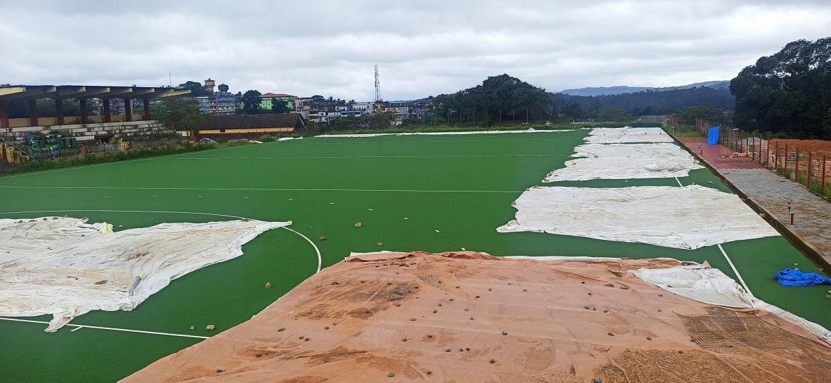 The incomplete work on the turf ground in Somwarpet.