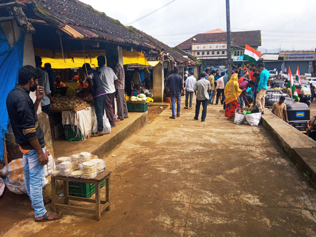 Vendors sell vegetables in the Suntikoppa market on Sunday.