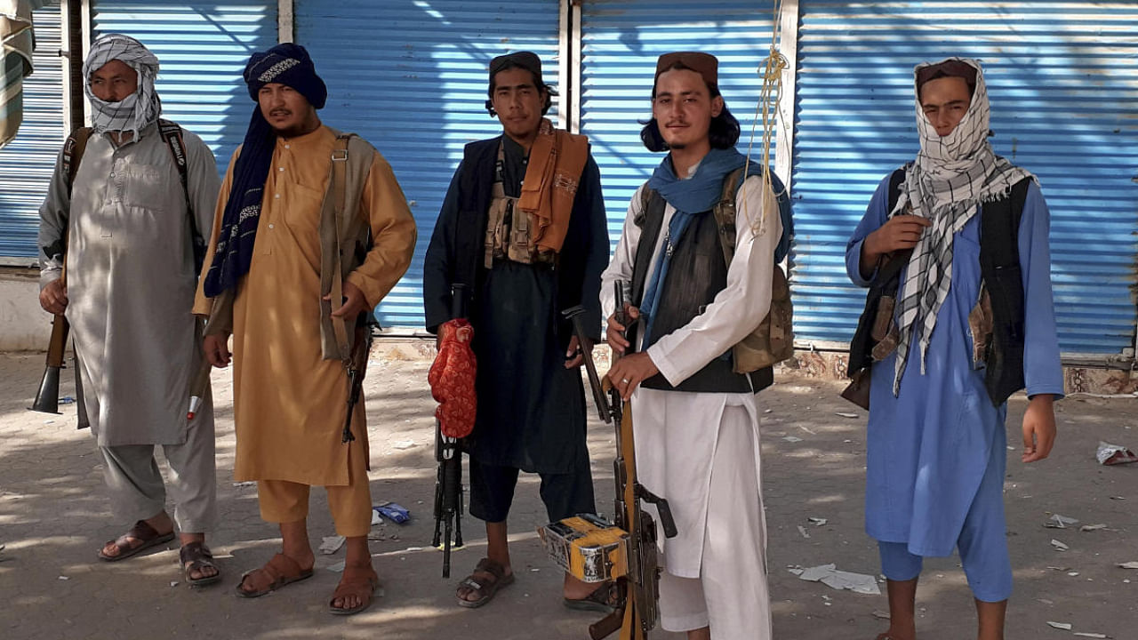 Taliban fighters stand guard in Kunduz city, northern Afghanistan. Credit: AP Photo