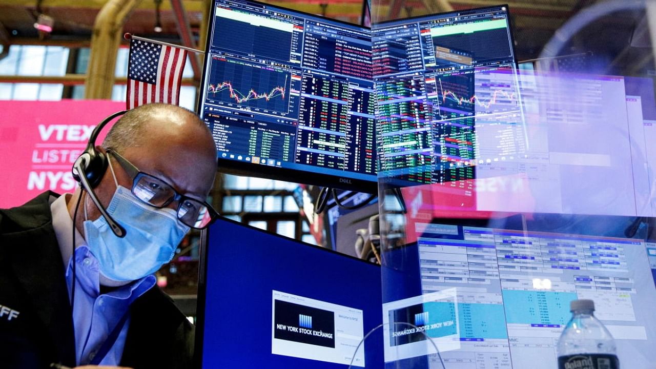 A trader works on the floor of the New York Stock Exchange (NYSE) in New York City. Credit: Reuters photo