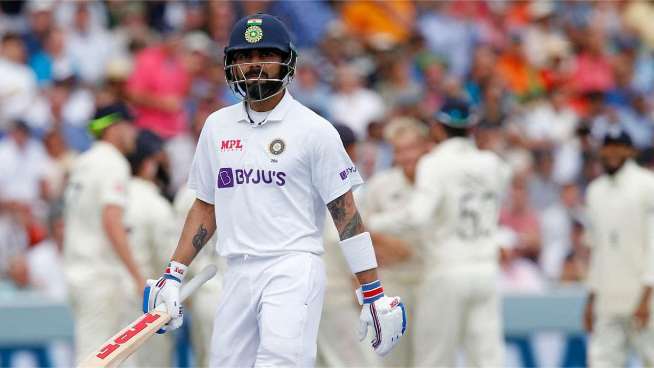 India's captain Virat Kohli walks back to the pavilion after losing his wicket for 20 runs on the fourth day of the second cricket Test match between England and India at Lord's cricket ground in London. Credit: AFP Photo