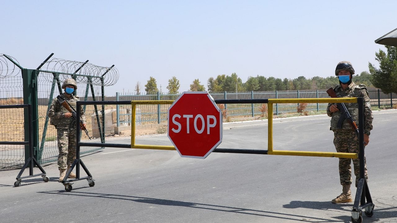 Border guards are seen at a checkpoint at the Uzbekistan-Afghanistan border in Ayritom. Credit: Reuters Photo