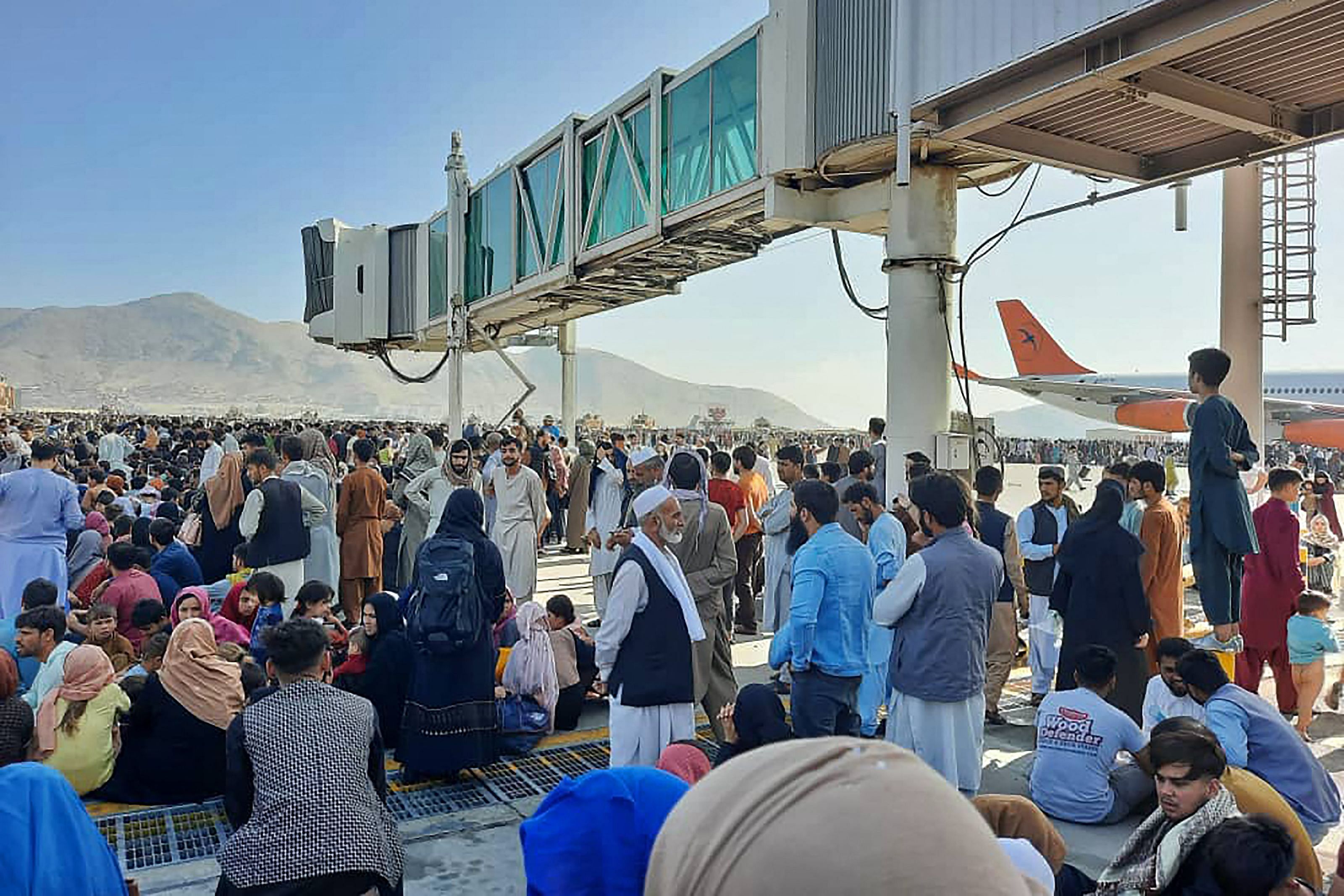 Thousands of Afghans rushed into Kabul's main airport on Monday, some so desperate to escape the Taliban that they held onto a military jet as it took off and plunged to their deaths. Credit: AFP Photo