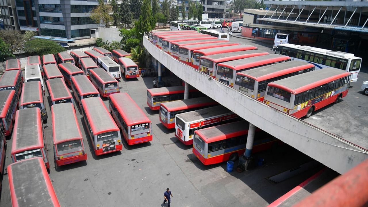 Several buses stationed during the indefinite strike called by RTC workers, at Satellite Bus stand, Mysore Road in Bengaluru. Credit: DH Photo