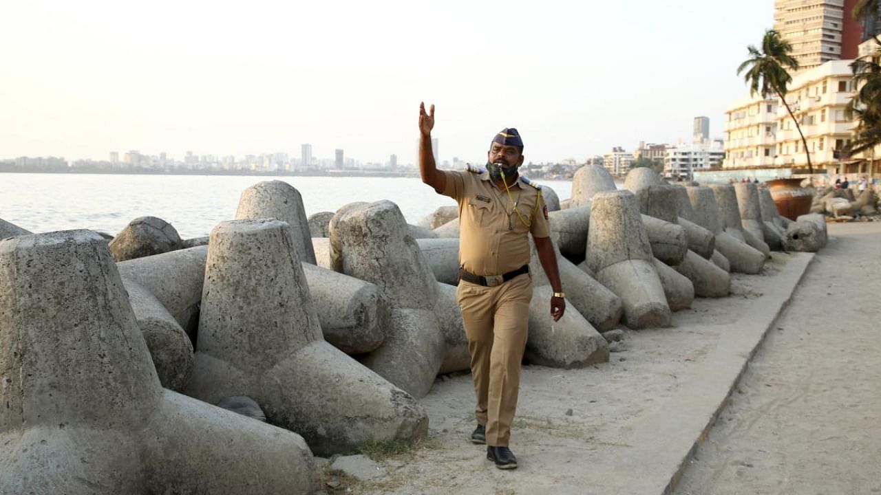 Police person partrols after public spaces were closed to curb the spread of coronavirus, at Dadar in Mumbai. Credit: PTI Photo