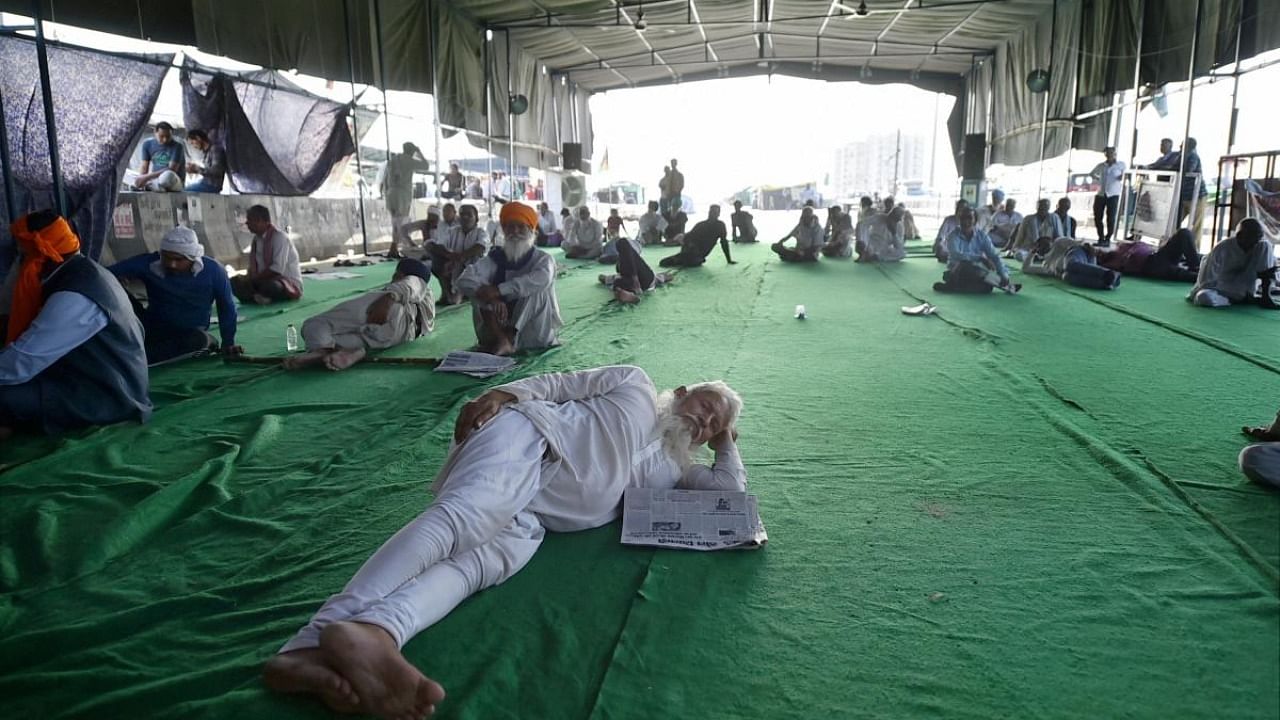 Farmers during their ongoing protest against the new farm laws, at Ghazipur border in New Delhi. Credit: PTI Photo