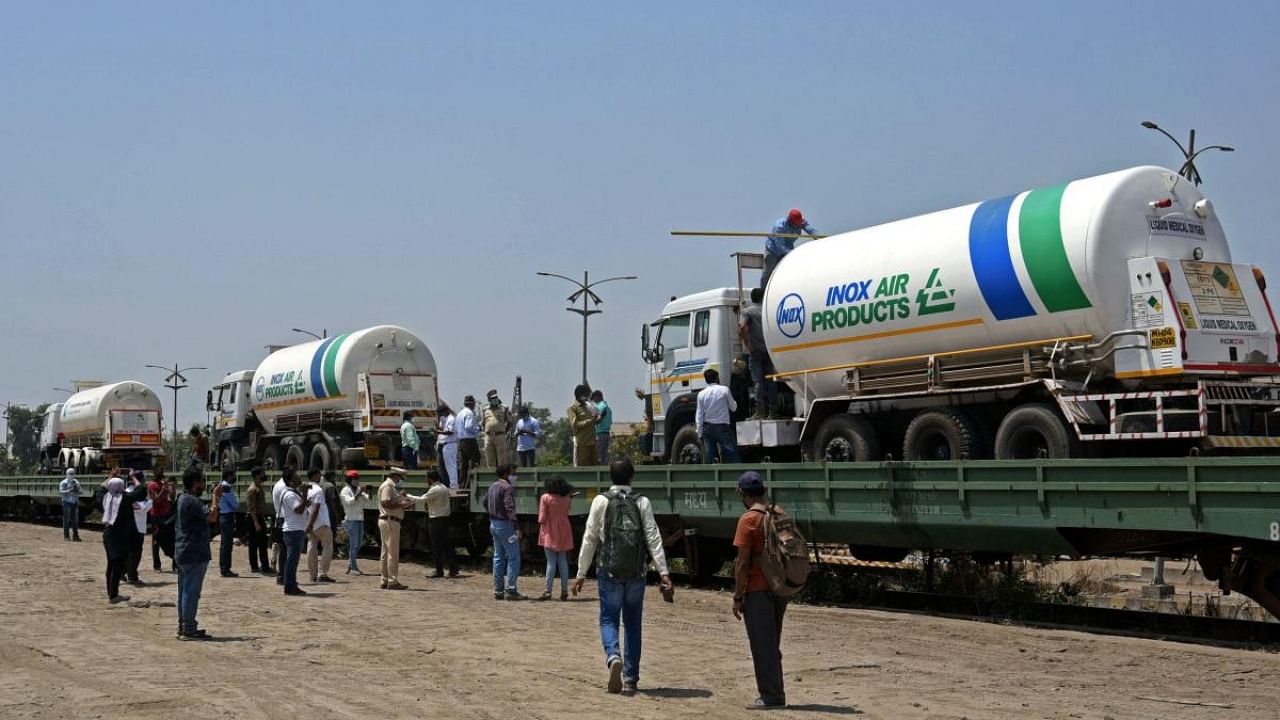 Oxygen tankers are seen being boarded on a special train 'Oxygen Express' that would transport to the needy states amid Covid-19 coronavirus pandemic at a goods yard in Navi Mumbai. Credit: AFP Photo
