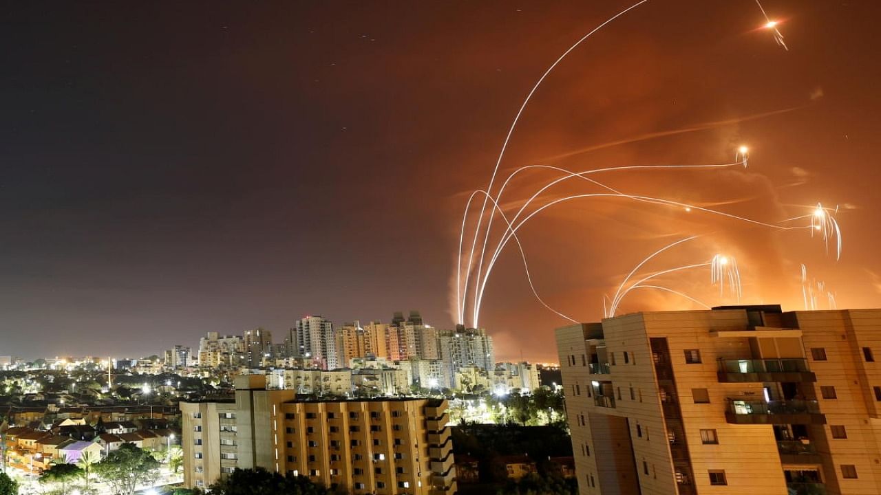 Streaks of light are seen as Israel's Iron Dome anti-missile system intercept rockets launched from the Gaza Strip towards Israel, as seen from Ashkelon, Israel. Credit: Reuters Photo