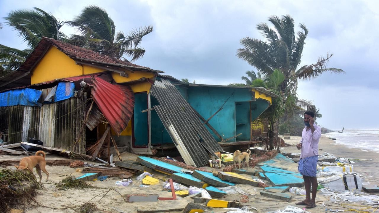 Houses destroyed at Meenakaliya, near Baikampady, due to the impact of cyclone Tauktae. DH Photo/Govindraj Javali