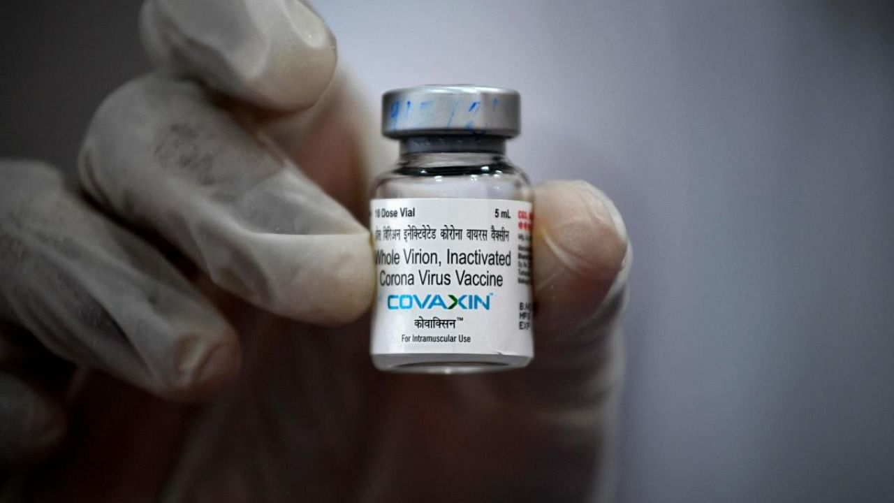 A medical worker displays a vial of the Covaxin vaccine against the Covid-19 coronavirus at a vaccination centre in Mumbai. Credit: AFP Photo