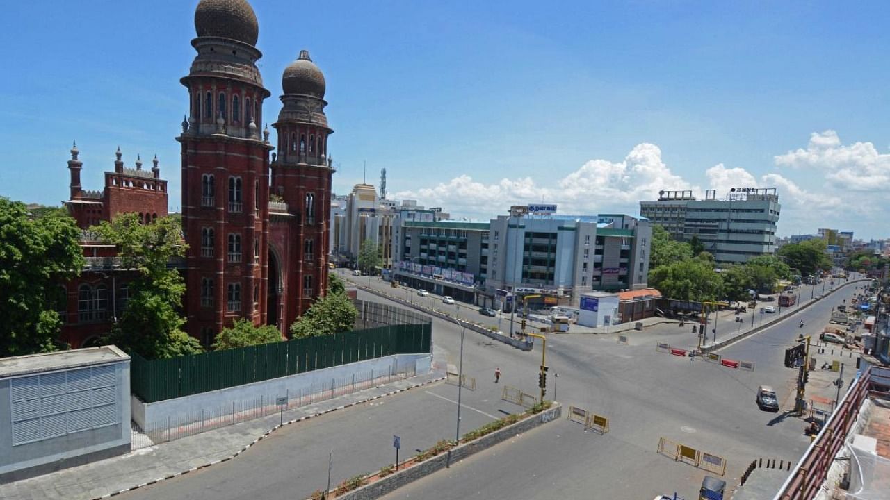 A deserted view of a road next to the Madras High Court during the Covid-induced lockdown in Chennai. Credit: AFP Photo
