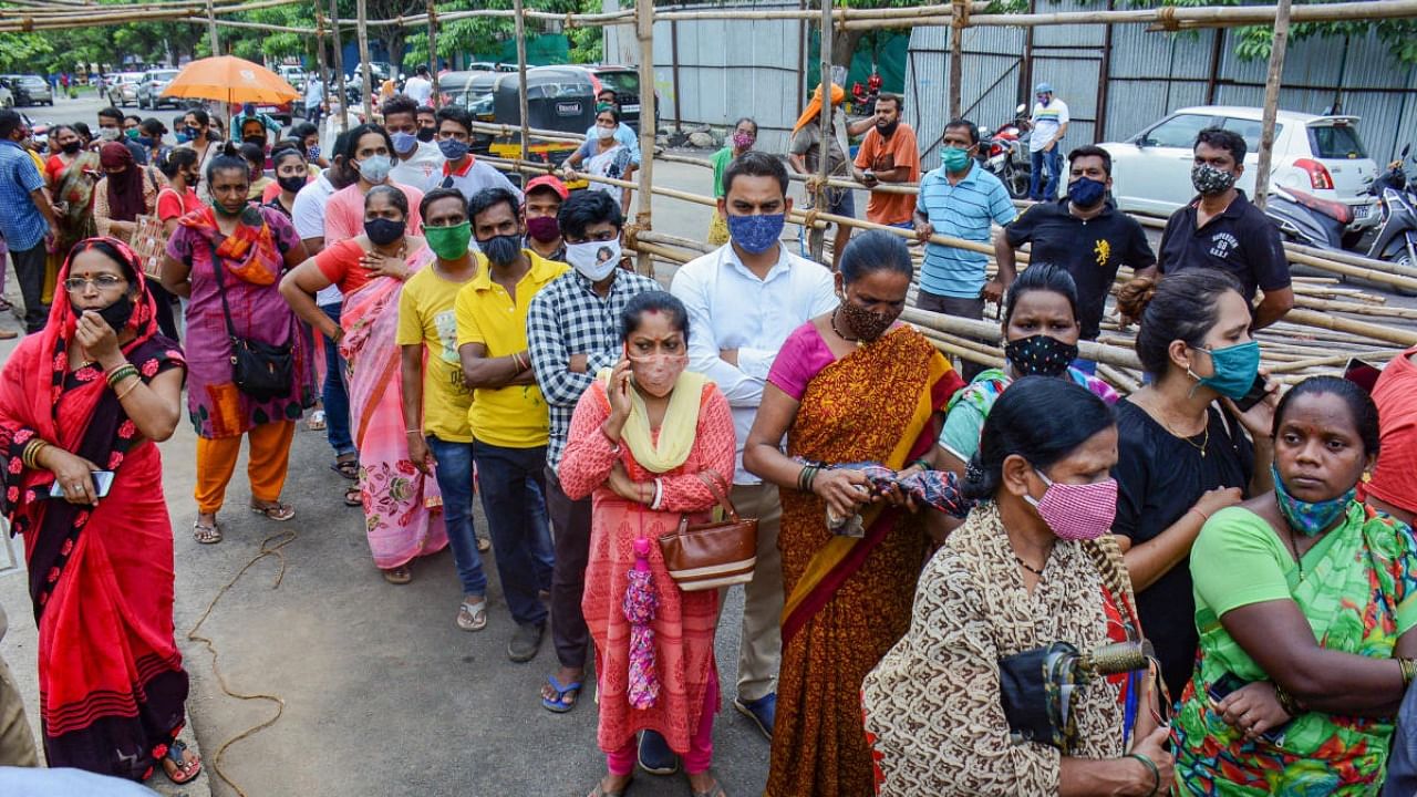 Beneficiaries wait to receive a dose of Covid-19 vaccine at the newly started vaccination centre in Patlipada Ghodbunder Road organized by Thane Municipal Corporation, in Thane. Credit: PTI Photo
