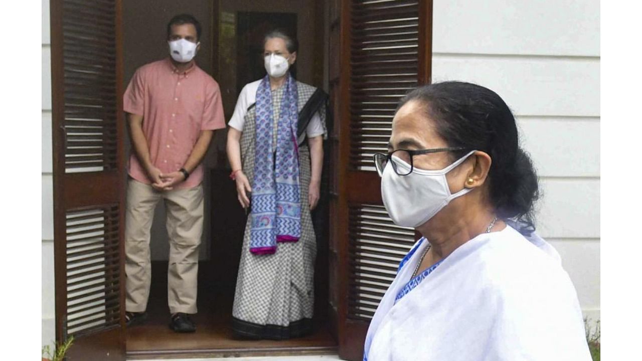 West Bengal CM Mamata Banerjee leaves after meeting Congress Interim President Sonia Gandhi in New Delhi. Congress leader Rahul Gandhi is also seen. Credit: PTI Photo