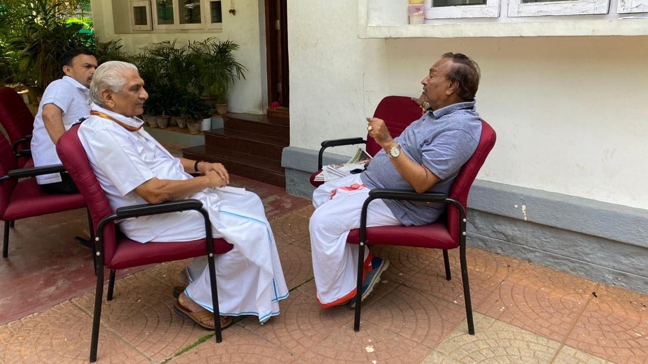 RSS leader Kalladka Prabhakar Bhat and K S Eshwarapppa in conversation. Credit: Special Arrangement 