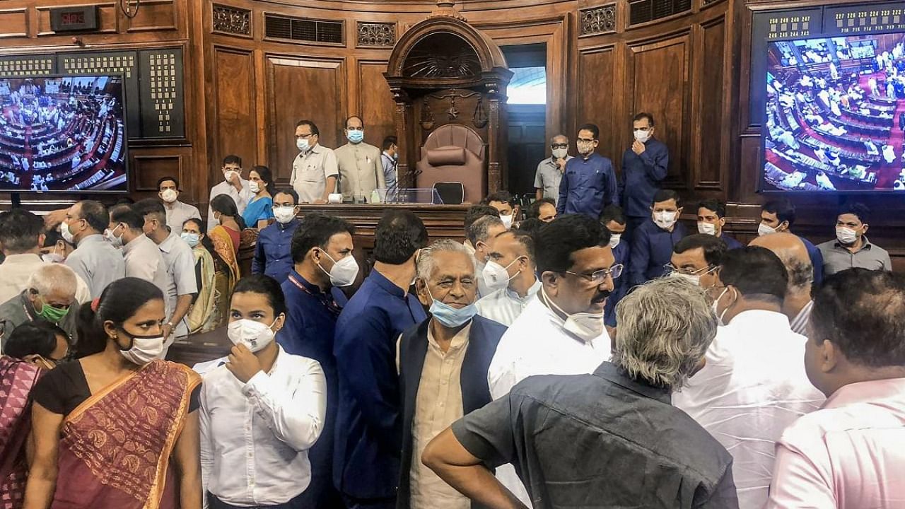  MPs protest inside the Rajya Sabha during the Monsoon Session of Parliament, in New Delhi. Credit: PTI Photo