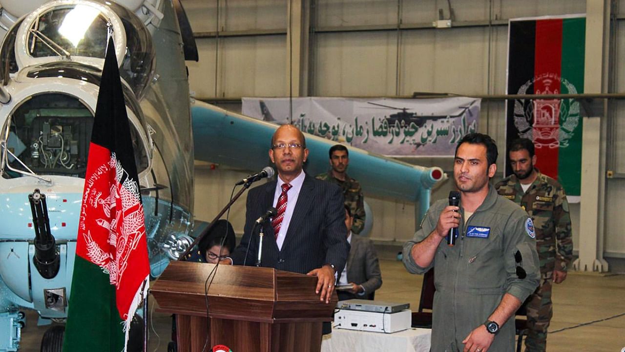 Afghanistan's acting Defence Minister Asadullah Khalid thanks Indian Ambassador Vinay Kumar for handing over a second pair of Mi-24V helicopters to war-torn Afghanistan, at the military airport in Kabul in 2019. Credit: PTI File Photo