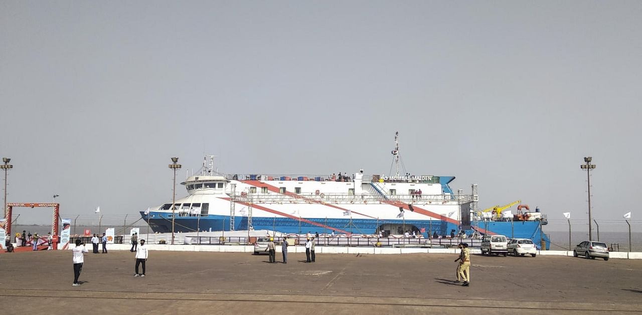Workers during the inauguration ceremony of Hazira-Diu cruise service, in Surat, Wednesday. Credit: PTI Photo