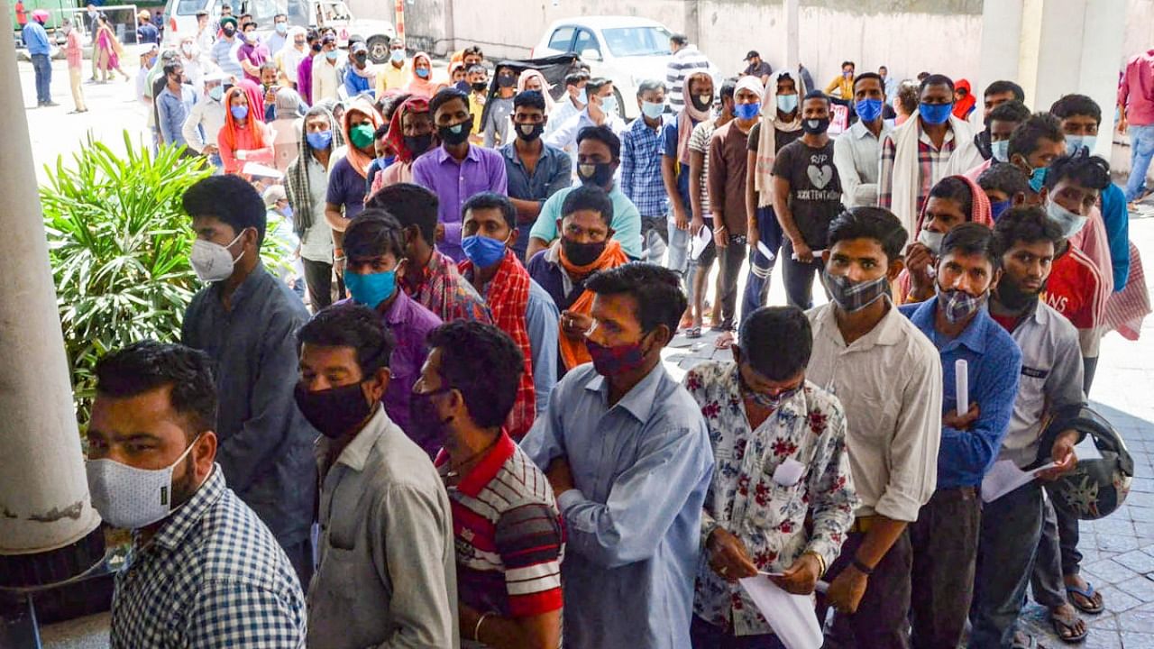 People wait to be tested for Covid-19 as coronavirus cases surge countrywide, at a hospital in Jammu. Credit: PTI Photo