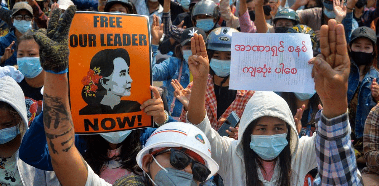Protesters make the three-finger salute during a demonstration against the military coup in Naypyidaw. Credit: AFP 
