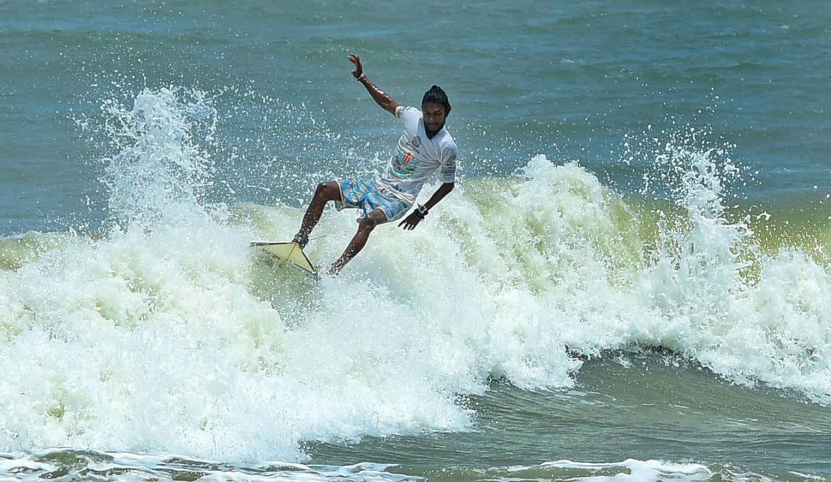 A surfer during the Indian Open of Surfing at Sasihithlu.