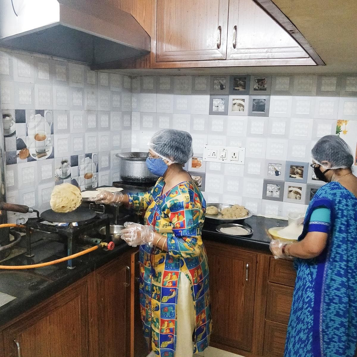 Rita Khakhar of Jalaram Caterers preparing a meal.