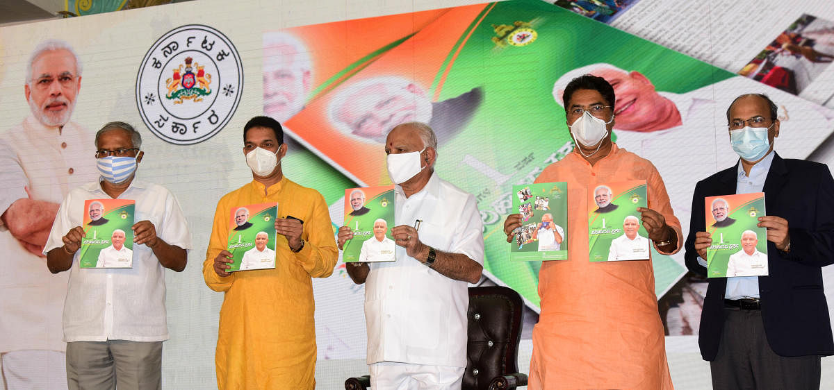 Karnataka Chief Minister B S Yediyurappa with his colleagues releases one-year performance report and achievement book, with Minister Sureshkumar, BJP State President Nalin Kumar Kateel, Minister R Ashok and Chief Secretary T M Vijay Bhaskar, during a pro