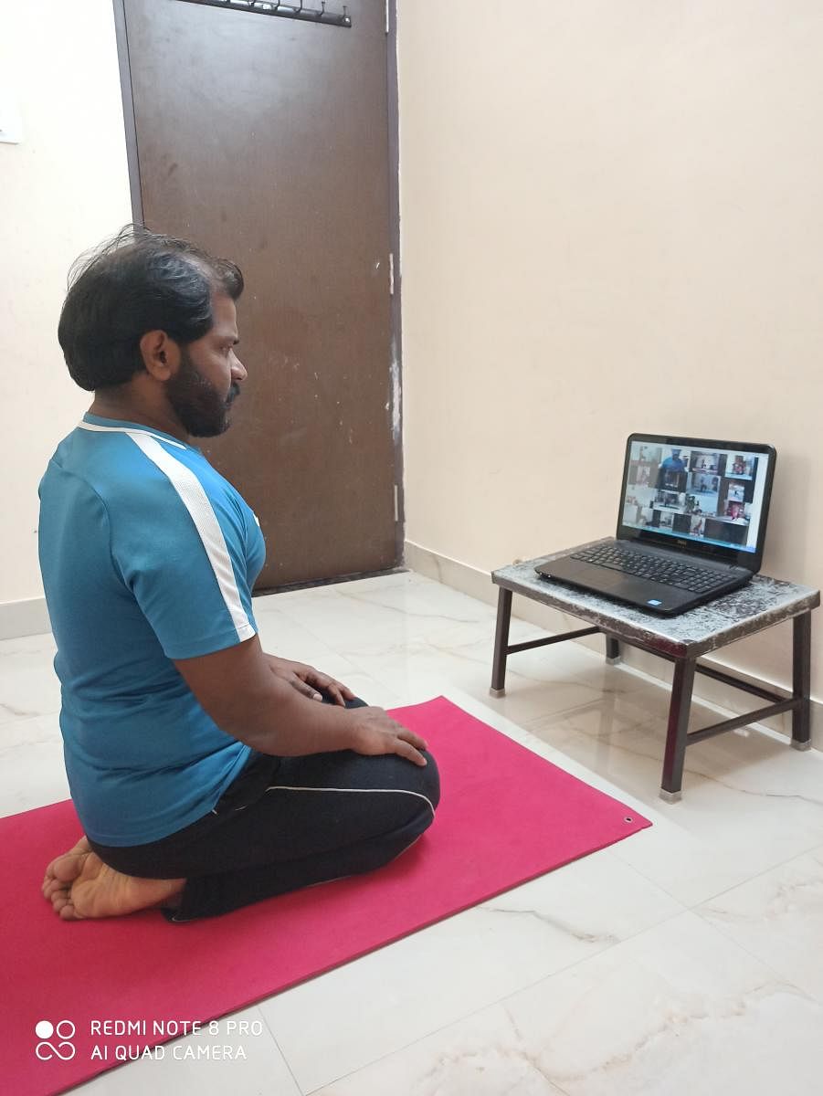 Students and staff like (above) Nagendran P, course director, Tapasya Yogashala, Sahakarnagar, are comfortable with online sessions. 