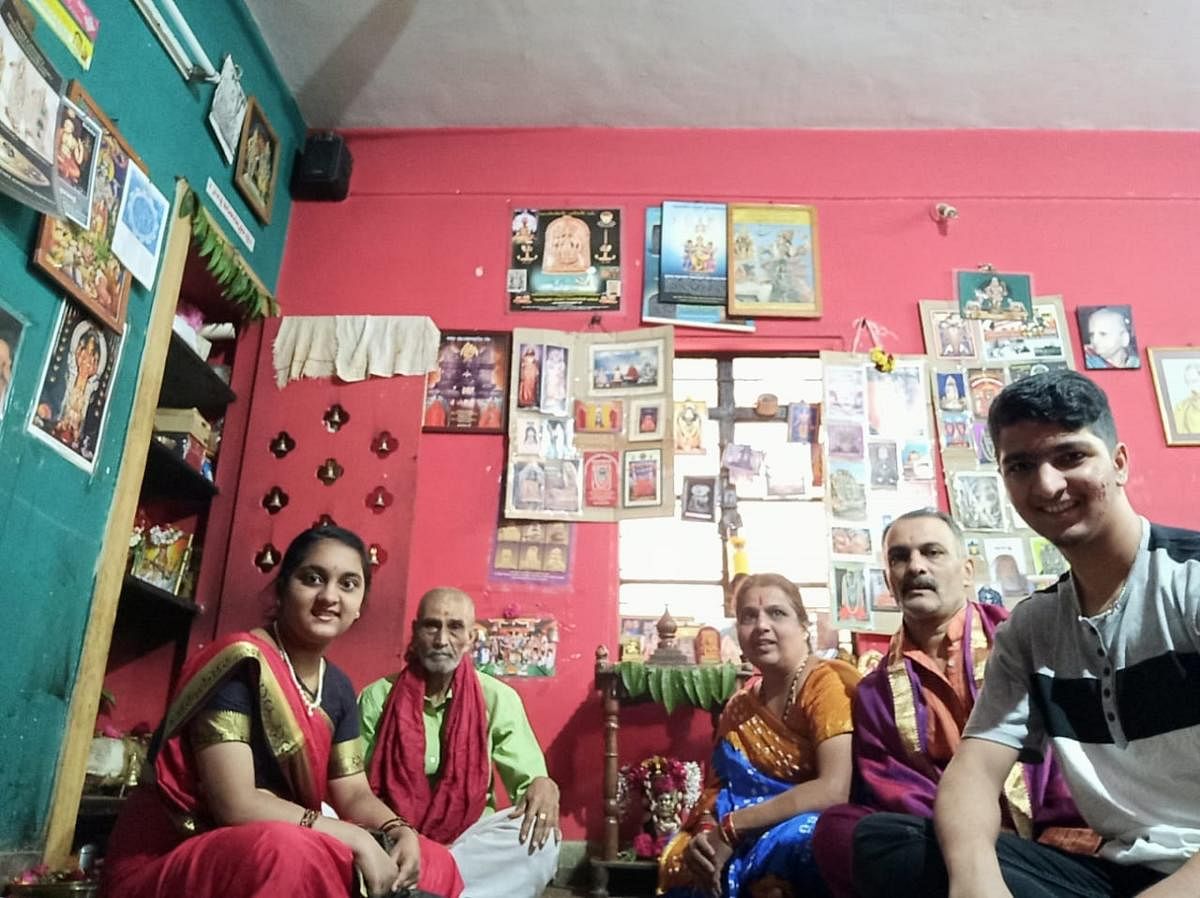 Vasuki Prasanna (center) with her family members. They will be doing the puja at home this year.