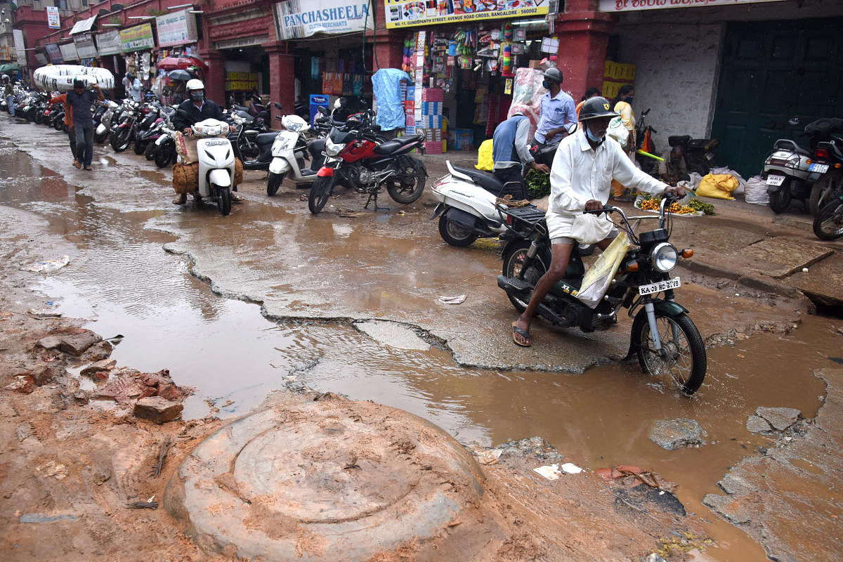 A stretch of Avenue Road after the recent rains. High Court recently directed the formation of an independent body to verify BBMP’s claim that city roads are in good condition. DH Photo by S K Dinesh