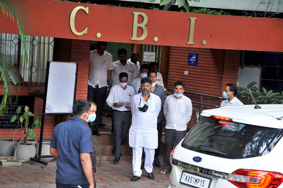 Karnataka Pradesh Congress Committee president D K Shivakumar leaves the CBI office after interrogation in connection with disproportionate assets case, in Bengaluru on Wednesday. DH Photo/Pushkar V
