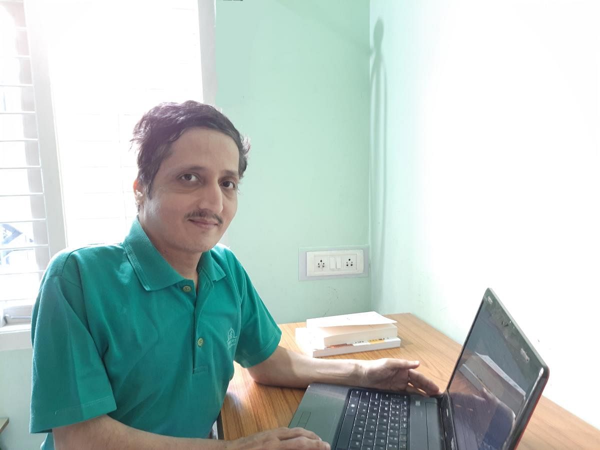 Raghavendran V, physically challenged, freelances for Android phone app developers.