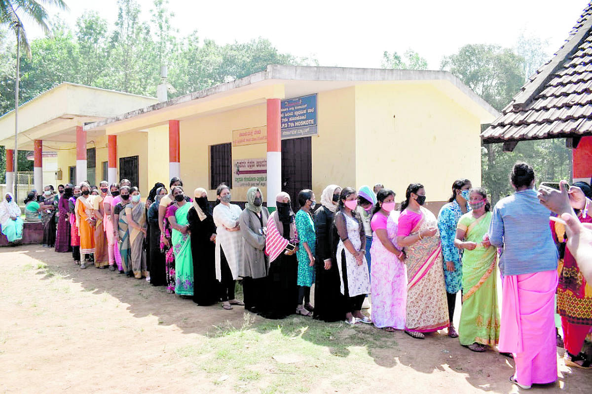 Voters made a beeline in front of the polling booth in Seventh Hosakote near Suntikoppa.
