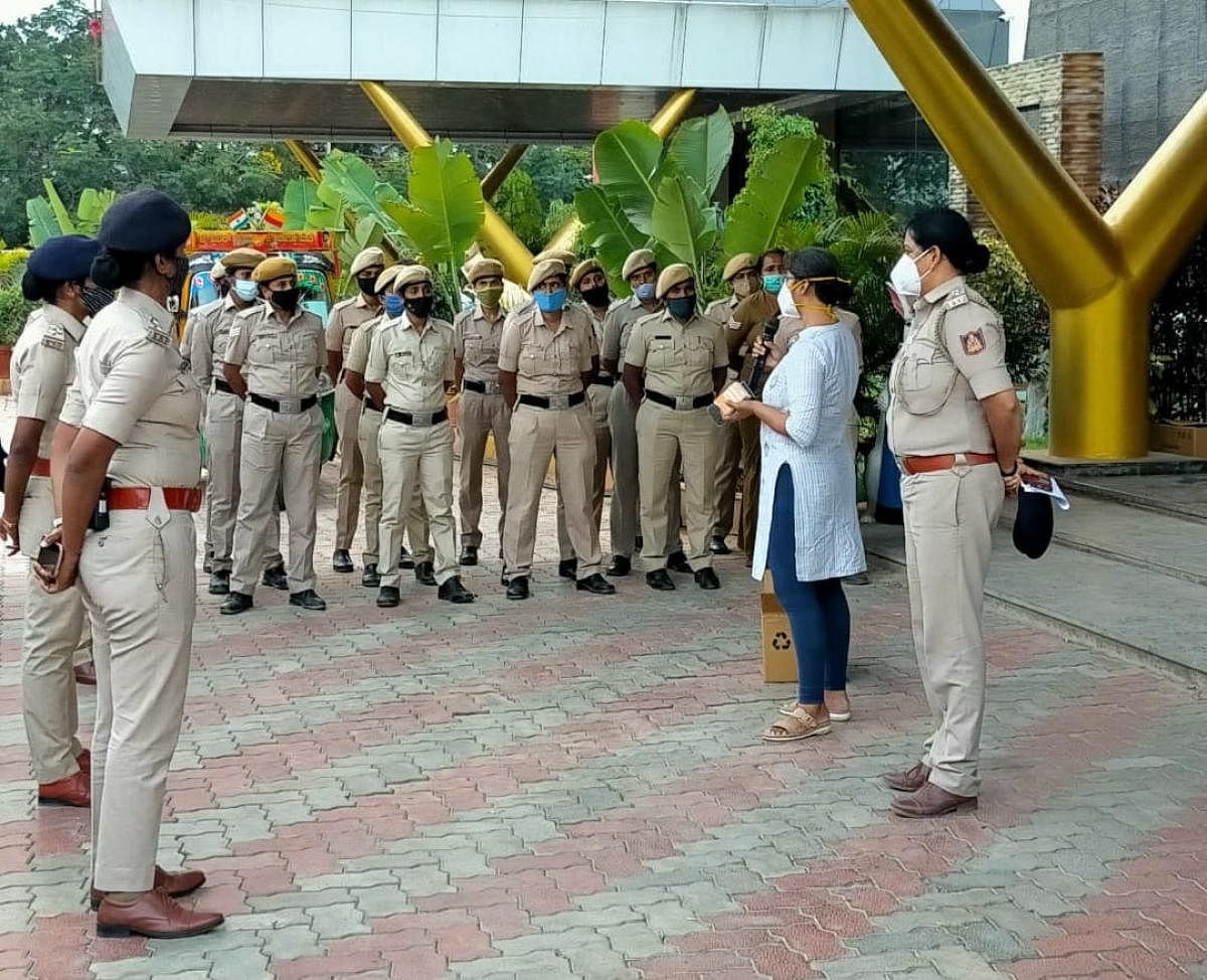 Nisha James (in kurta) , deputy commissioner of police, addresses women in the police department as part of a campaign to help them maintain menstrual hygiene.