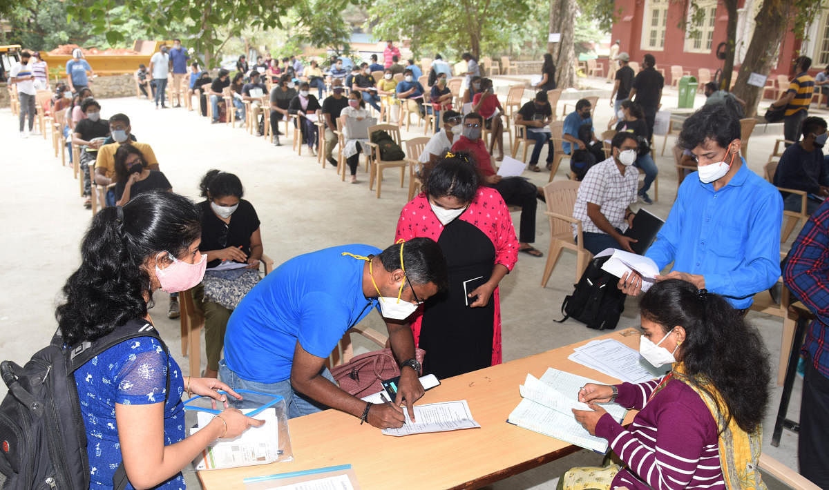 A BBMP vaccination camp for students and professionals headed abroad, at the Bengaluru City University campus. Most took the WHO-approved Covishield vaccine. DH Photo by S K Dinesh