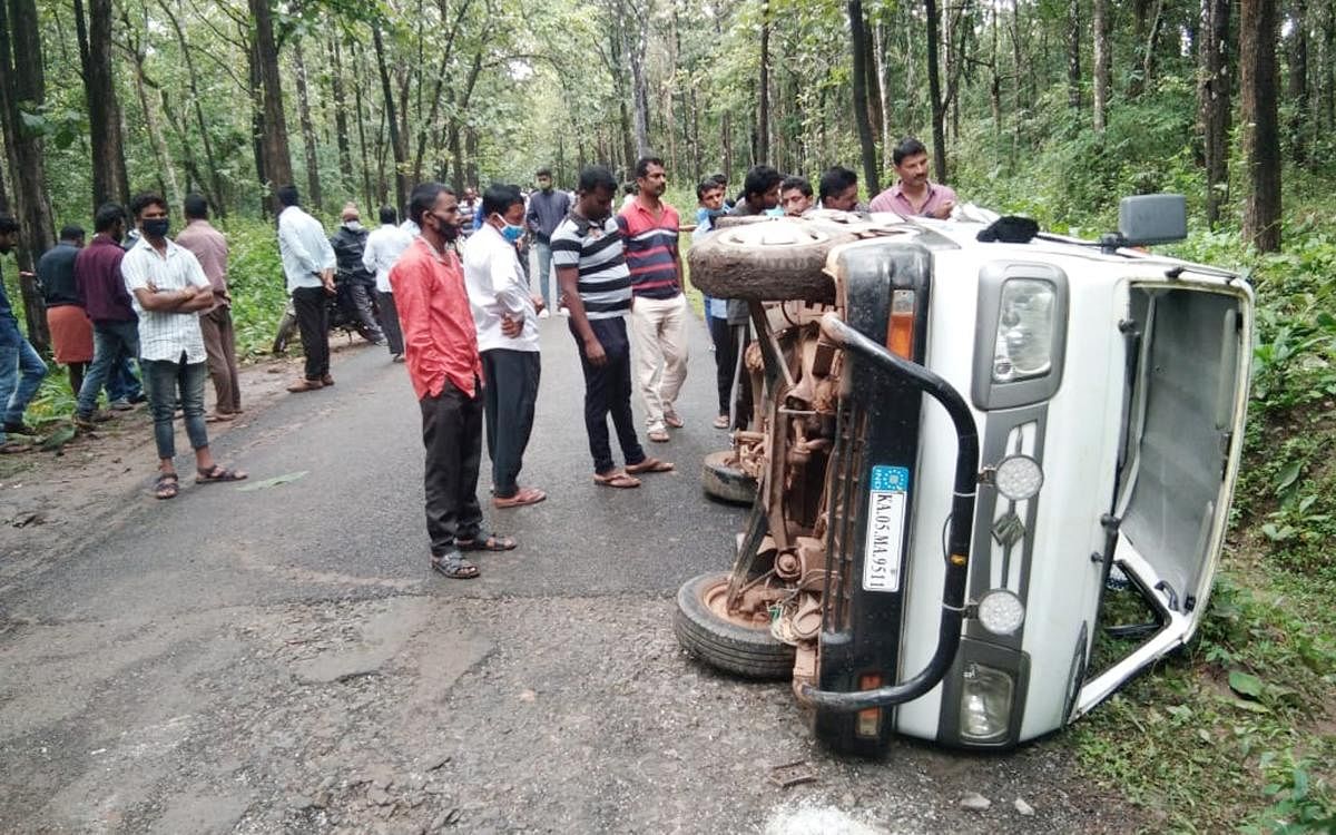 The car that was toppled in the wild jumbo attack at Kundur village in Mudigere taluk of Chikkamagaluru district on Monday. Credit: DH Photo