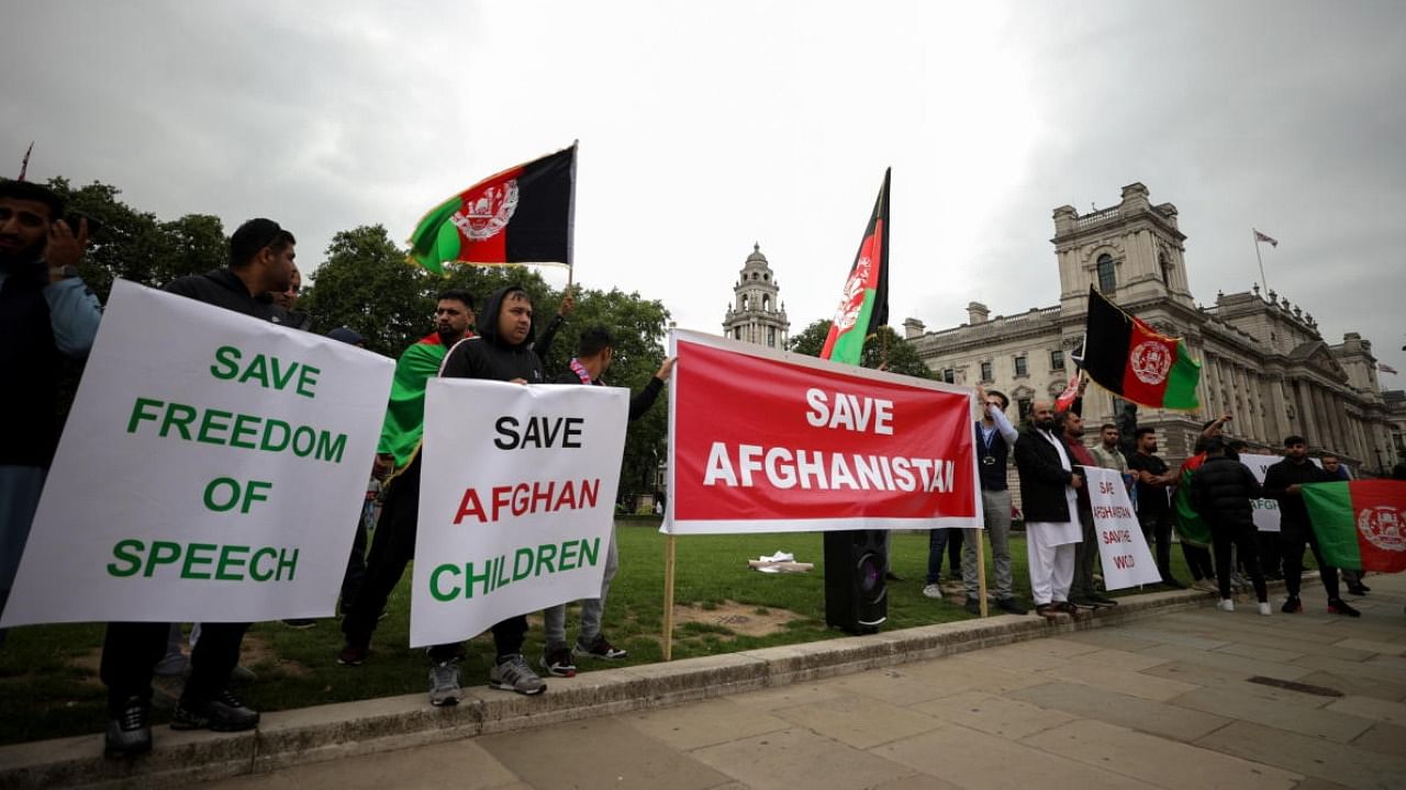 Demonstrators take part in a "Save Afghanistan" protest in Parliament Square, in London, Britain, August 17, 2021. Credit: PTI Photo