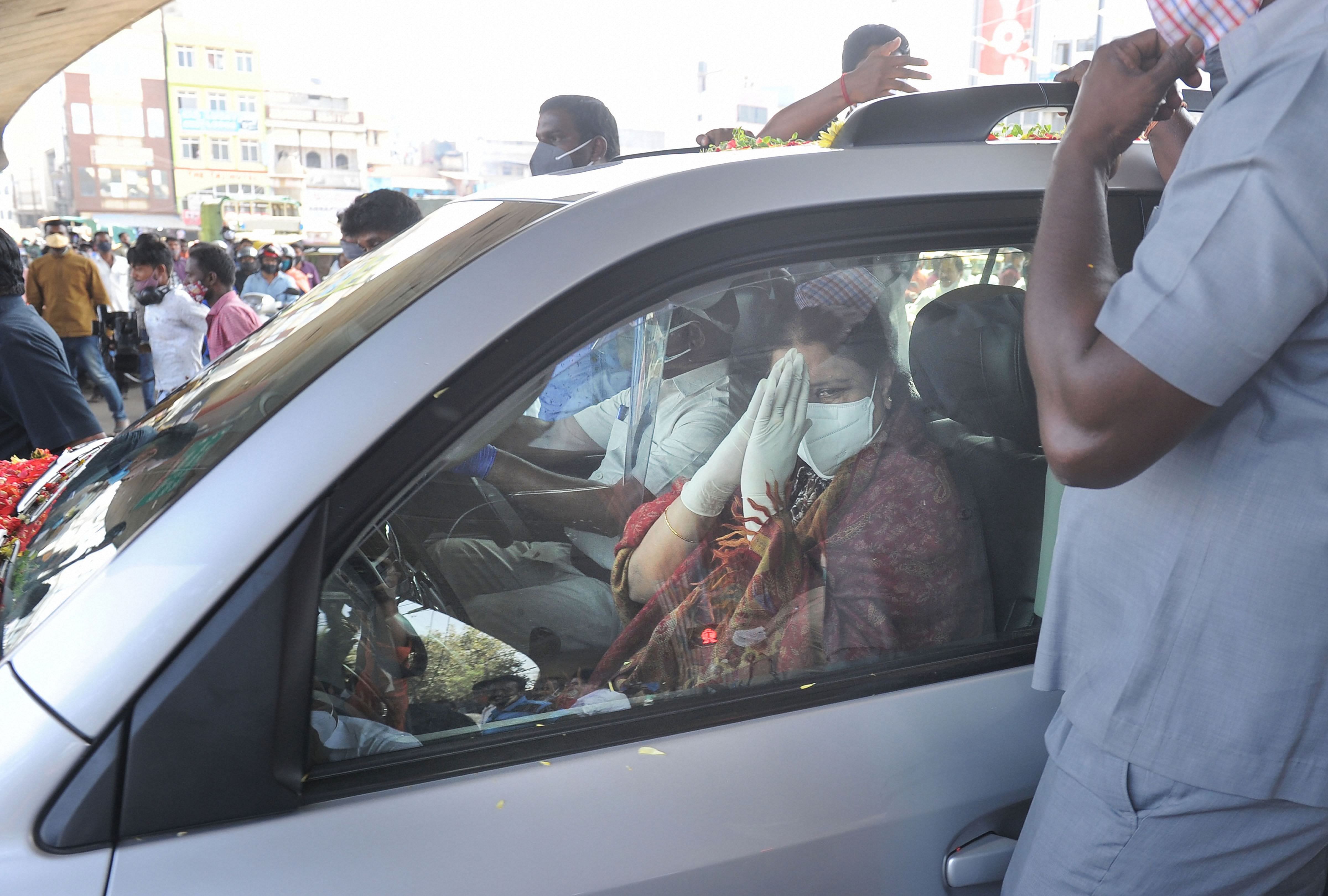 Sasikala, who walked to the car from the hospital building, was given a rousing welcome by her supporters. Credit: PTI