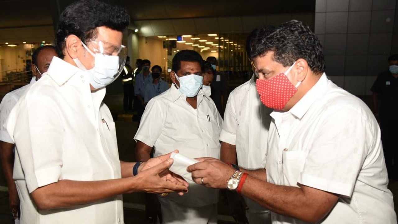 Finance Minister P T R Palanivel Thiagarajan welcomes Chief Minister M K Stalin at the airport in his home town of Madurai on May 20, 2021. Photo: Special Arrangement/DH photo