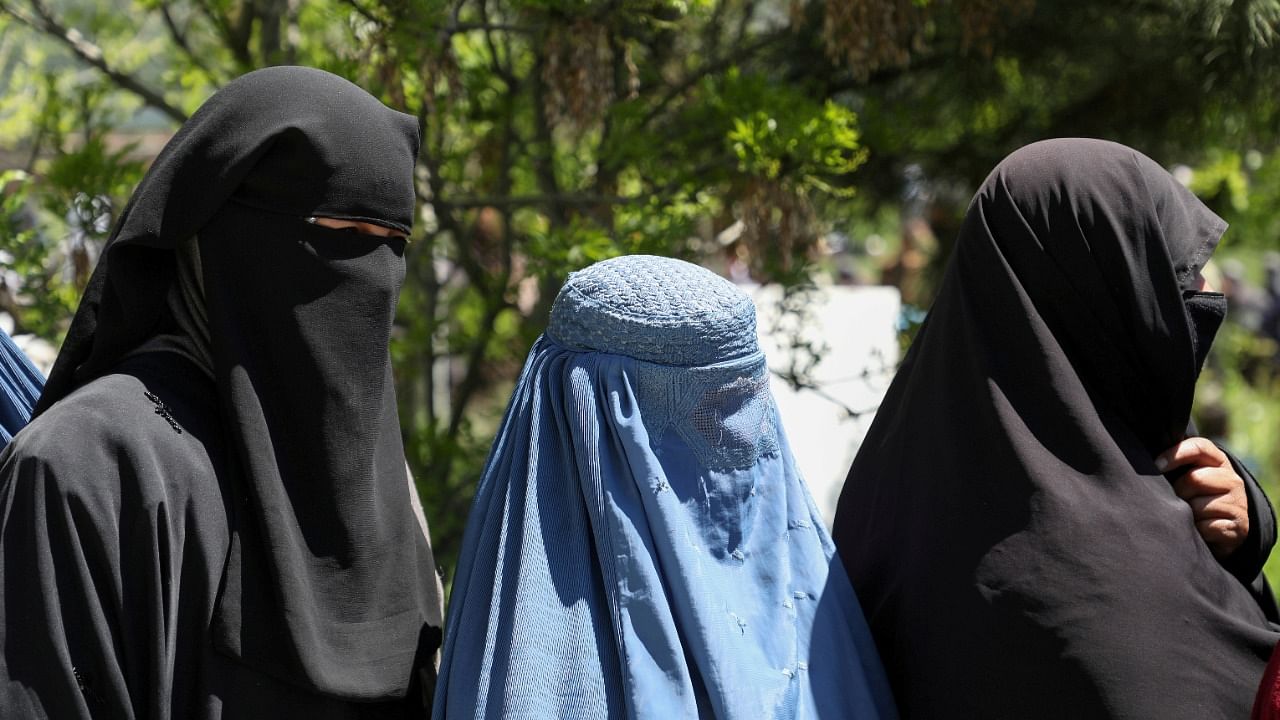 Women had to wear burqas to go out during the Taliban's previous rule. Credit: Reuters Photo