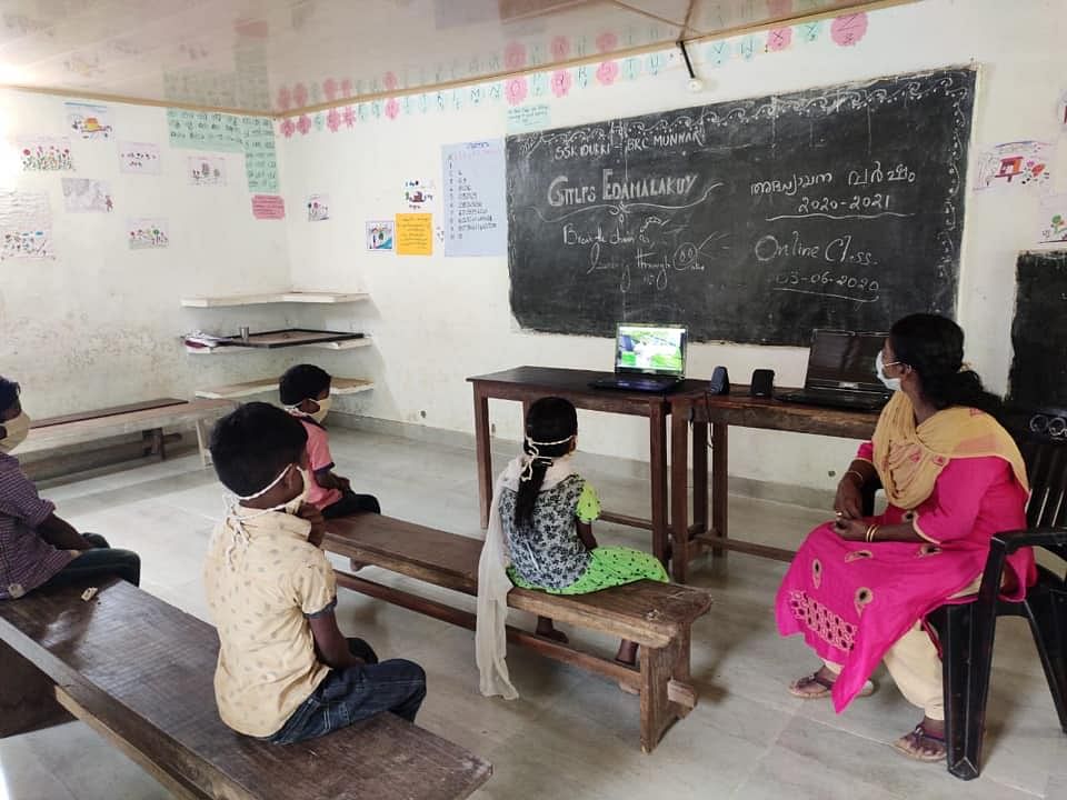 Students attending online class at Edamalakkudy, a tribal village about 15 kilometres into the forest in Idukki district in Kerala