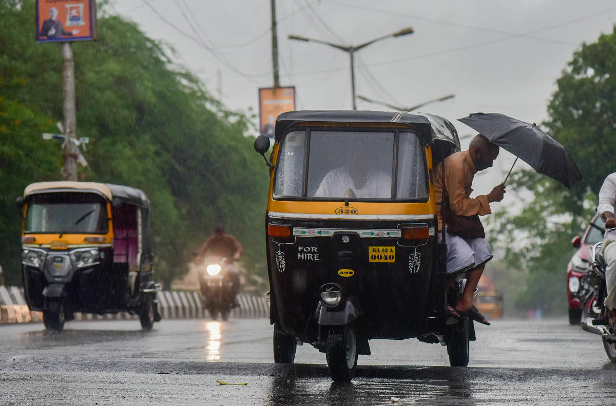 Umbrellas came out in Kalaburagi as the city received showers towards the evening on Wednesday. DH Photo/Prashanth H G