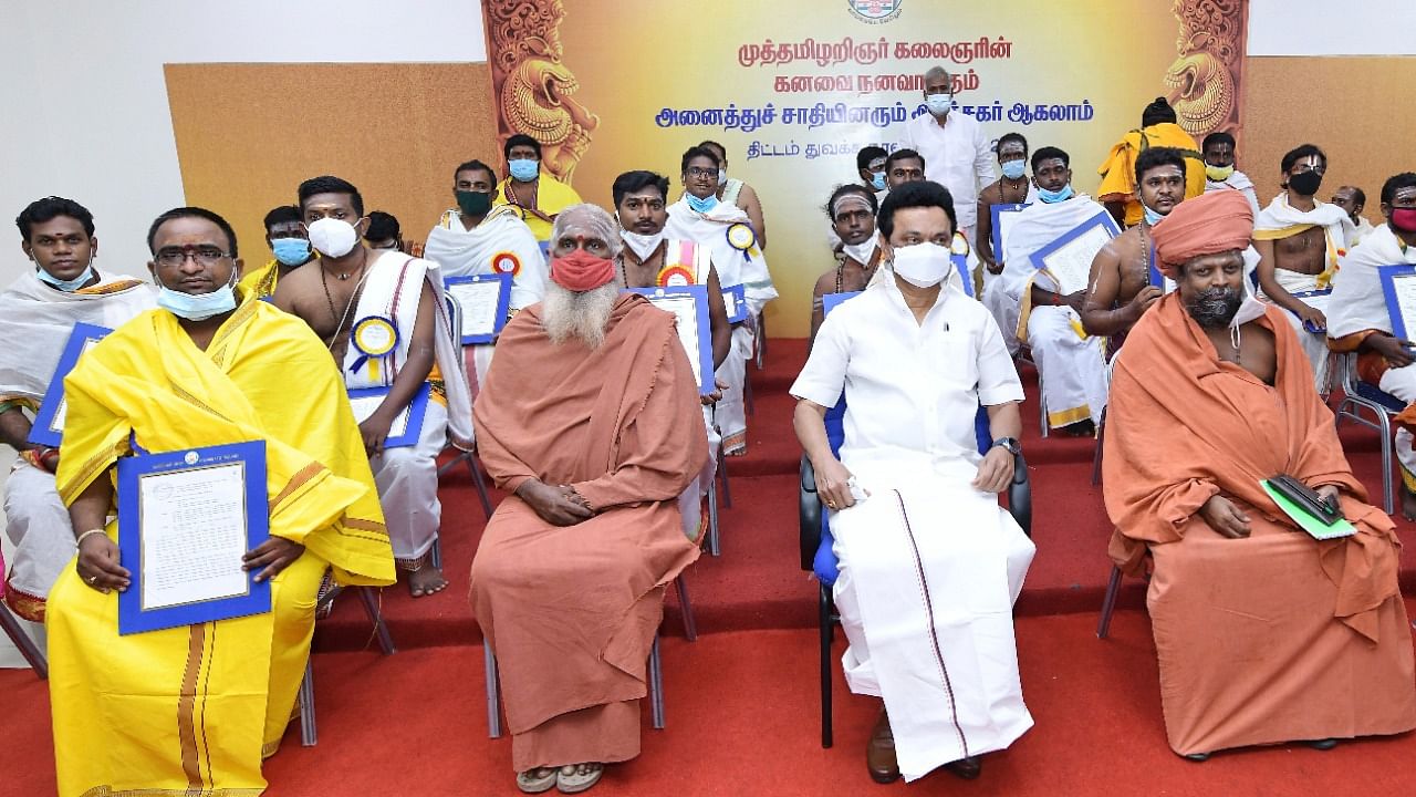 Chief Minister M K Stalin with newly-appointed priests from different communities on Saturday after handing over orders of appointment to them. Credit: DH Photo/Special Arrangement