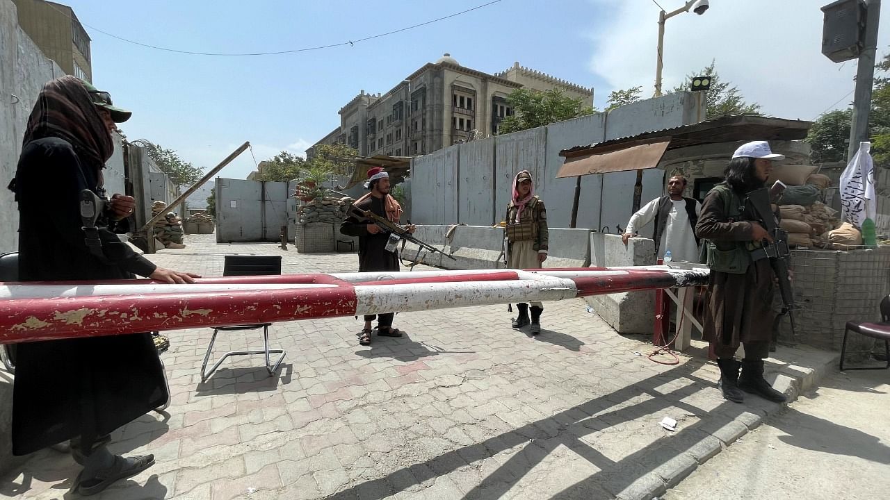 Members of Taliban forces keep watch at a check point. Credit: Reuters Photo