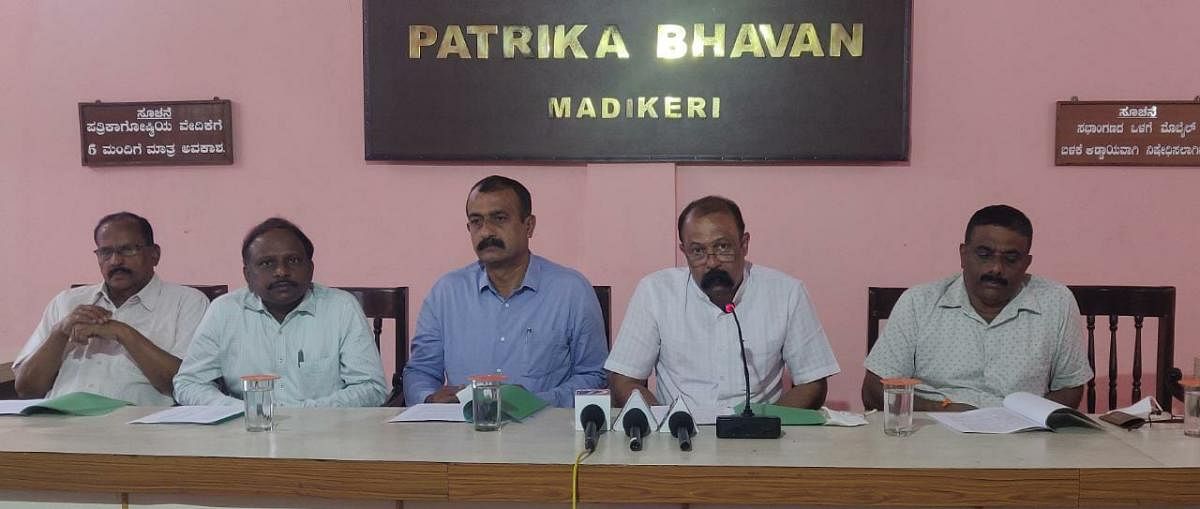 Kodagu District Cooperative Central Bank president Kodandera P Ganapathy speaks to reporters in Madikeri.