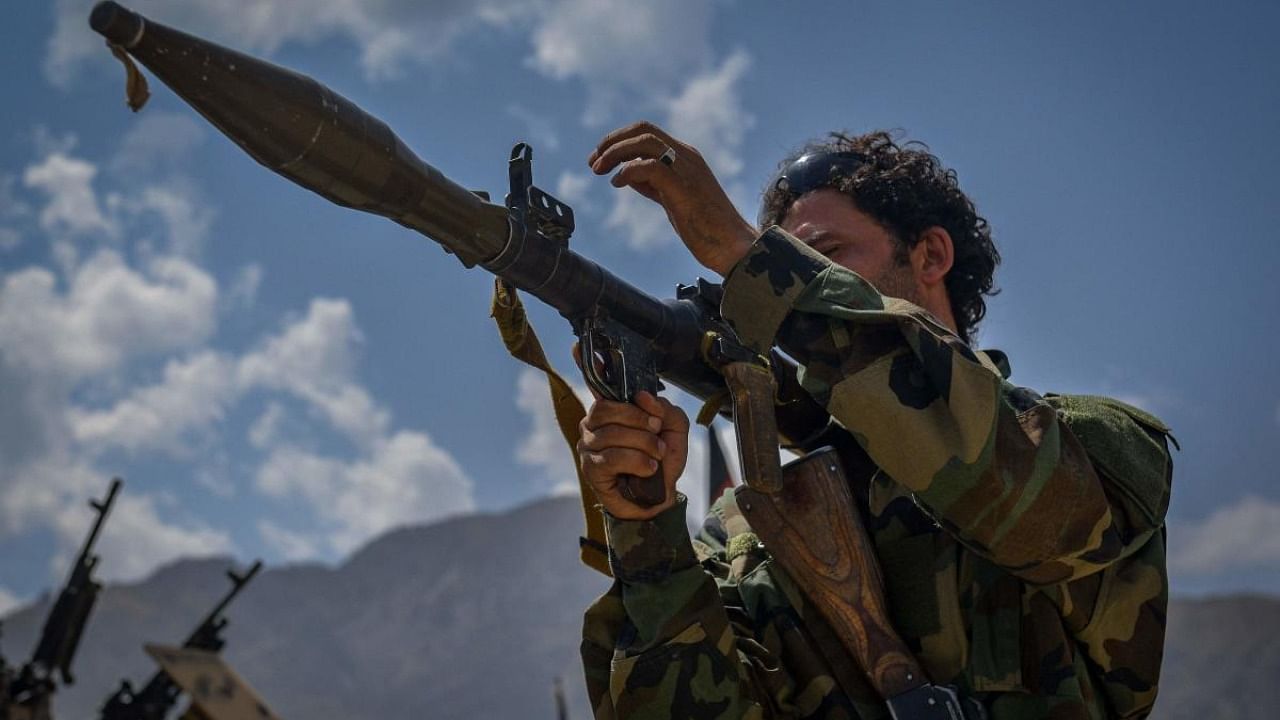 An Afghan armed man supporting the Afghan security forces against the Taliban pictured with weapons at Parakh area in Bazarak, Panjshir province on August 19, 2021. Credit: AFP Photo