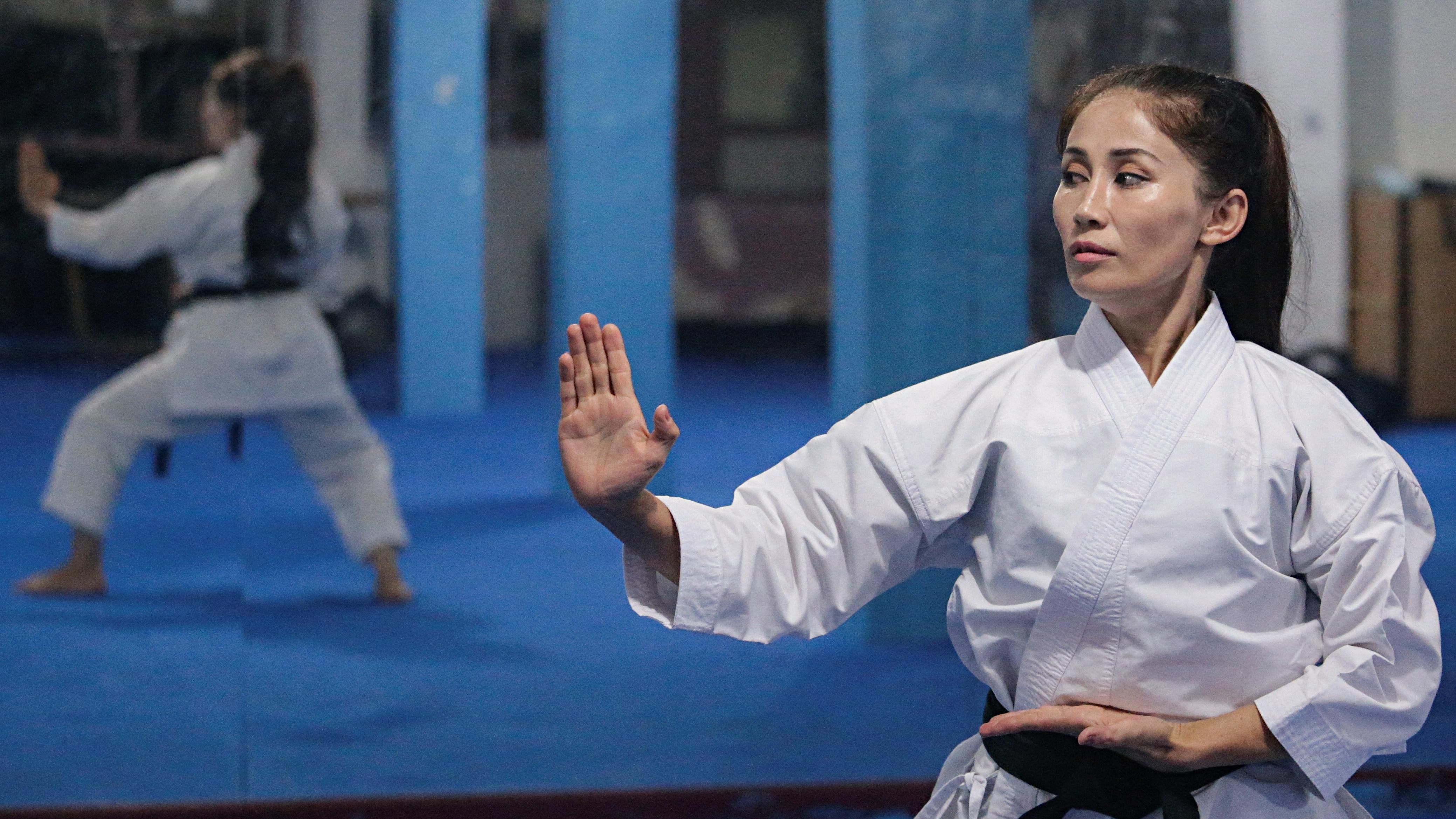 Meena Asadi, a 28-year-old former Afghan martial arts athlete practices karate at the Refugee Shotokan Club dojo in Cisarua, West Java province, Indonesia. Credit: Reuters Photo