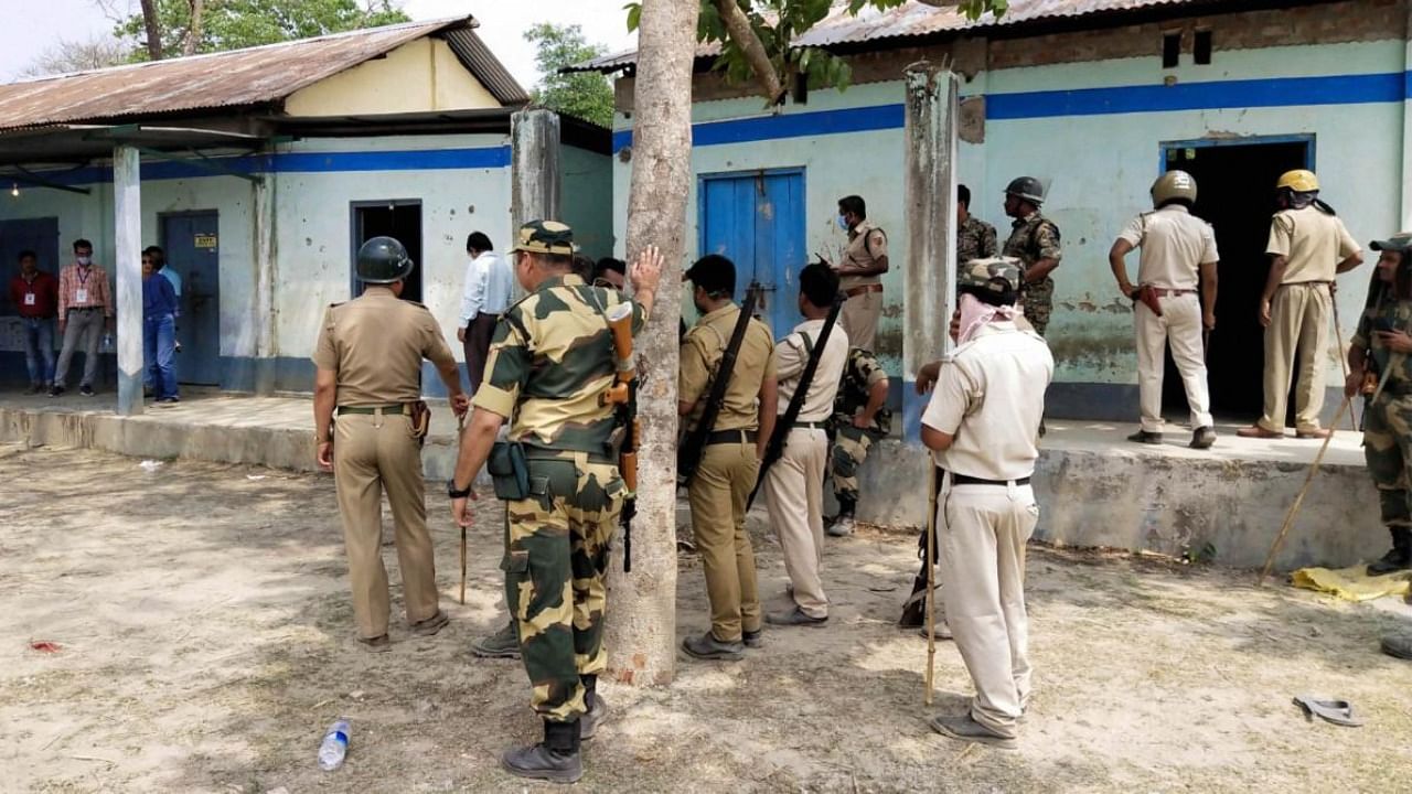 Security personnel keep vigil at a polling station after Election Commission ordered of stopping the voting exercise at polling station number 126 in Sitalkuchi, where clashes erupted between locals and central forces, at Sitalkuchi in Cooch Behar district, Saturday, April 10, 2021. Credit: PTI File Photo