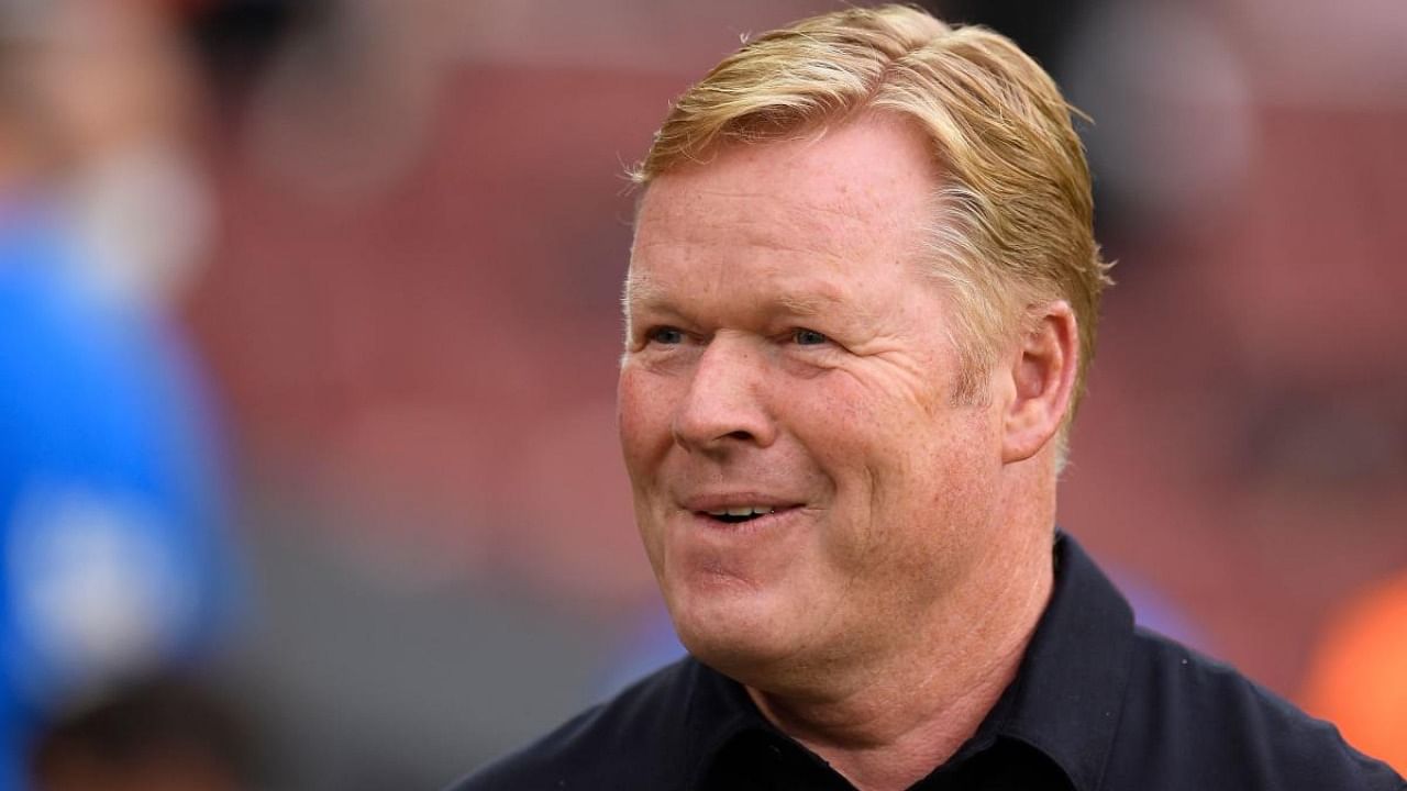 Barcelona's Dutch coach Ronald Koeman smiles during the Spanish League football match between Barcelona and Real Sociedad at the Camp Nou stadium in Barcelona on August 15, 2021. Credit: AFP Photo