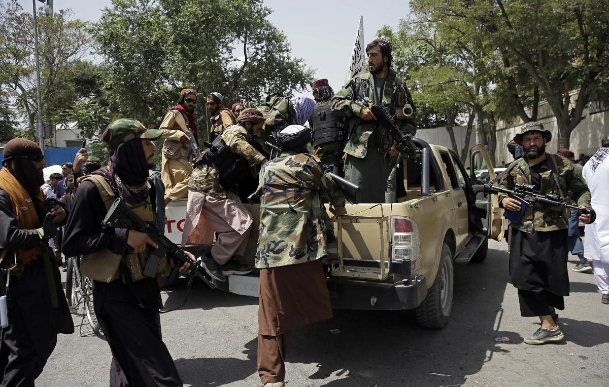 Taliban fighters patrol in Kabul, Afghanistan, Thursday, Aug. 19, 2021. The Taliban celebrated Afghanistan's Independence Day on Thursday by declaring they beat the United States, but challenges to their rule ranging from running a country severely. AFP